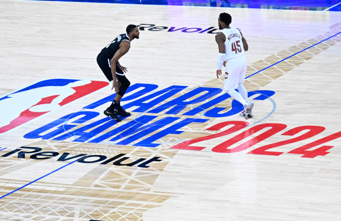 Cleveland Cavaliers guard Donovan Mitchell dribbles against Brooklyn Nets forward Mikal Bridges.